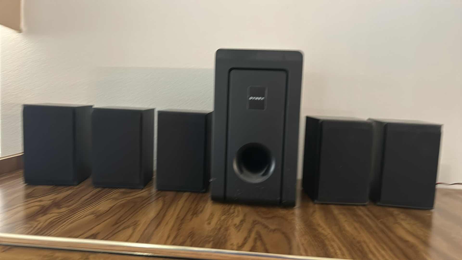 Photo 1 of DYNEX SPEAKER ASSORTMENT - 5 SURROUND SPEAKERS AND 1 SUBWOOFER SPEAKER