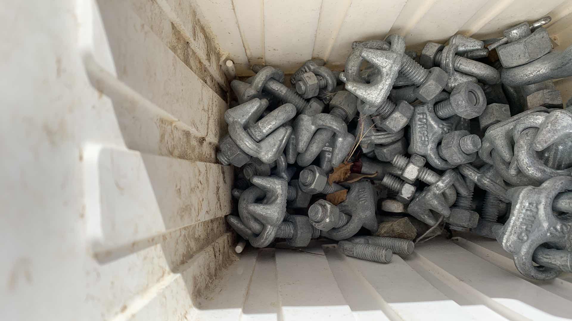Photo 1 of BIN OF DIFFERENT SIZED GALVANIZED CABLE CLAMPS