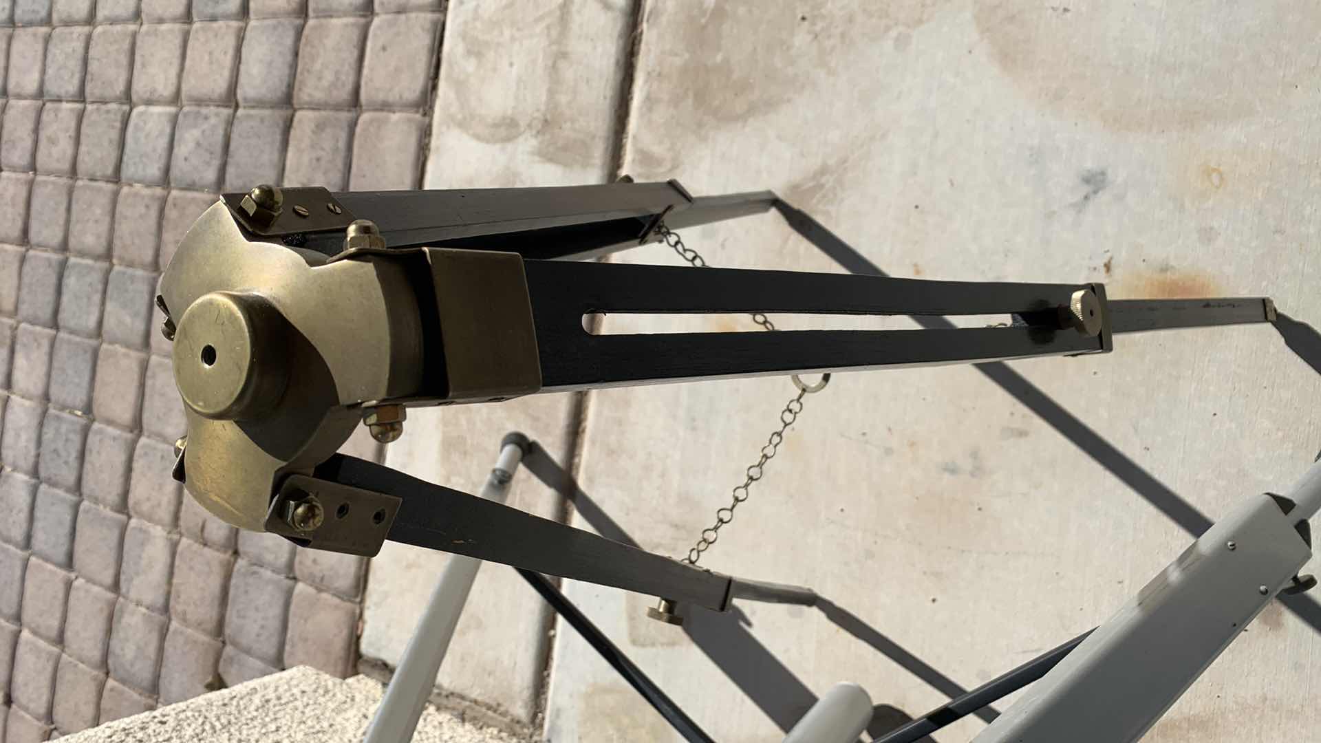 Photo 1 of A FLOATING ACTION TRIPOD AND A BRASS AND WOODEN ONE