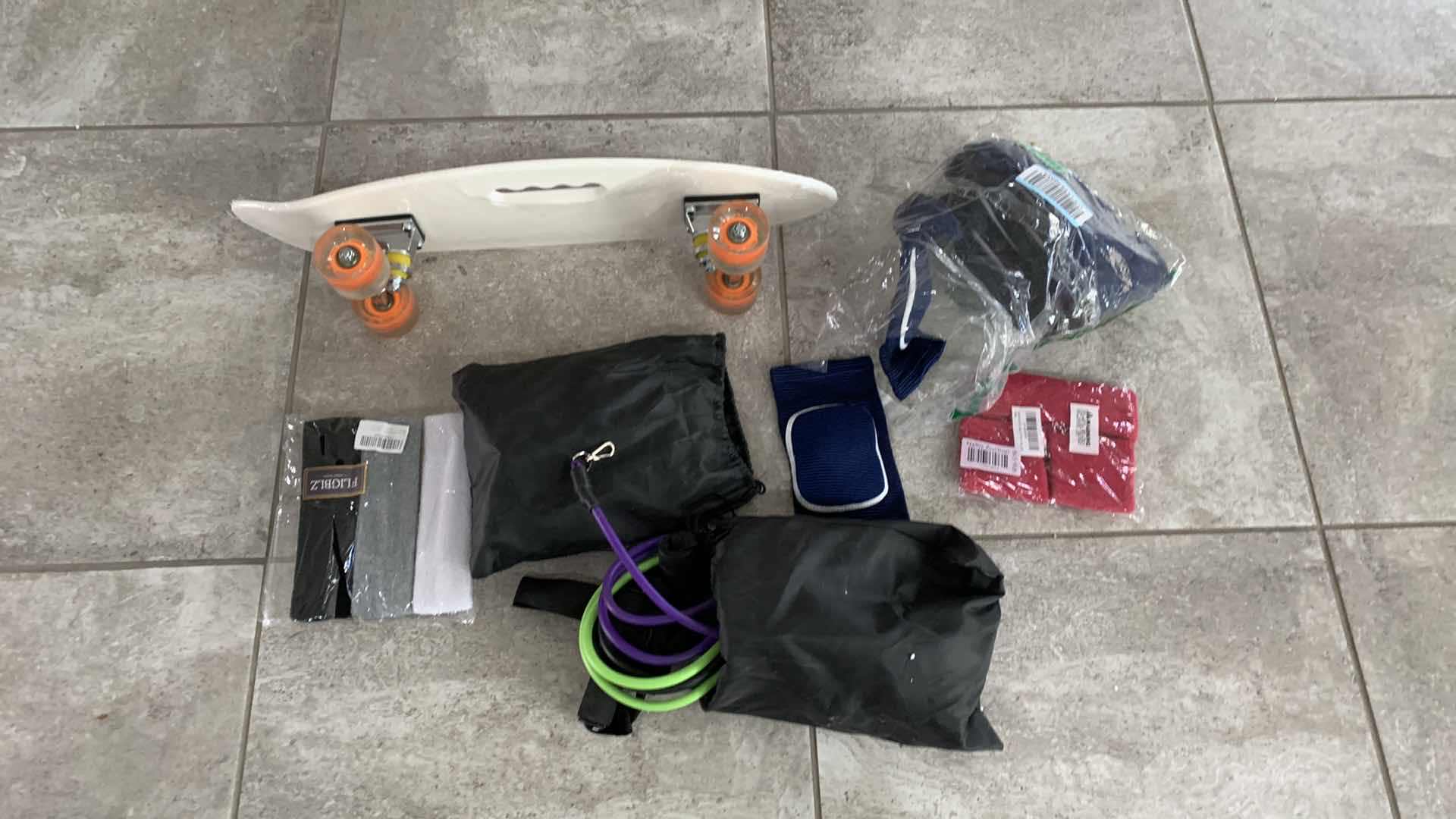 Photo 1 of EXERCISE ITEMS AND A SKATEBOARD