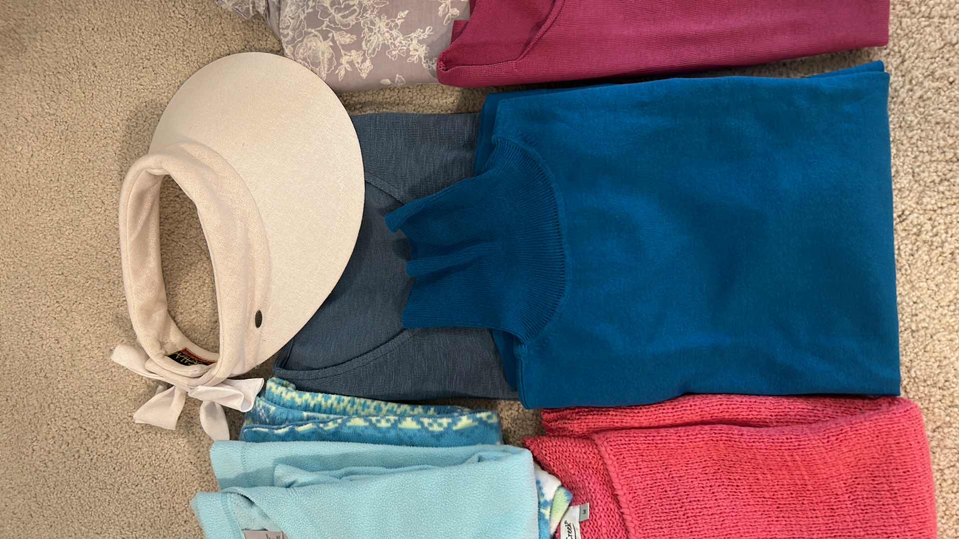 Photo 1 of CLOTHING ASSORTMENT AND SUN HAT