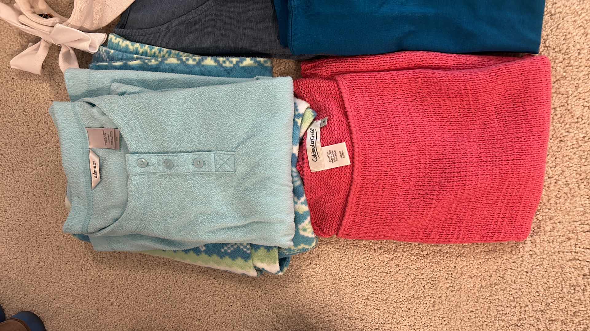 Photo 1 of CLOTHING ASSORTMENT AND SUN HAT