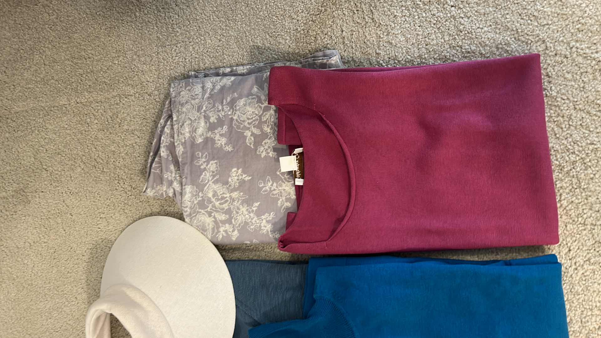 Photo 1 of CLOTHING ASSORTMENT AND SUN HAT