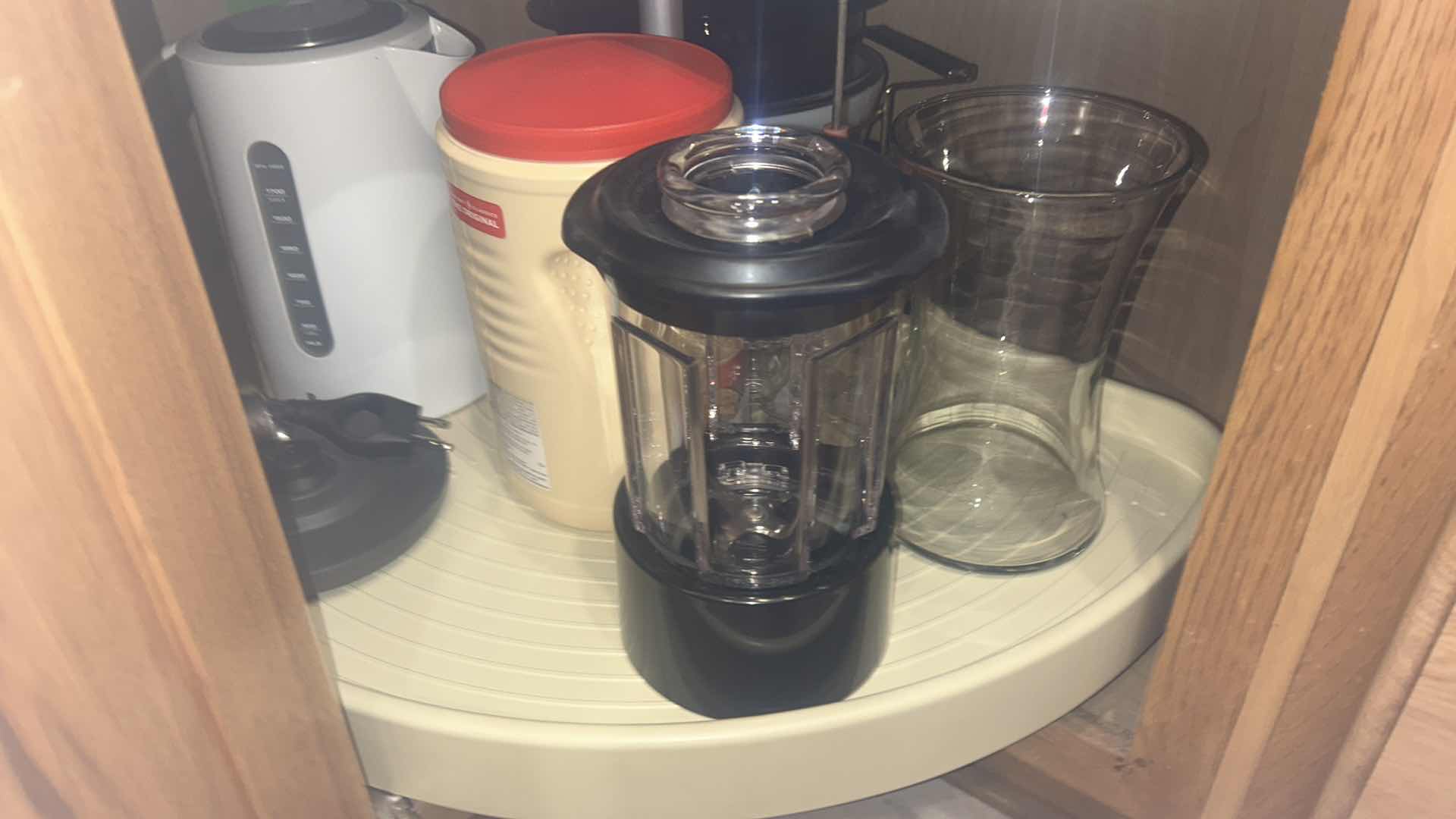 Photo 1 of CONTENTS OF KITCHEN CORNER CABINET