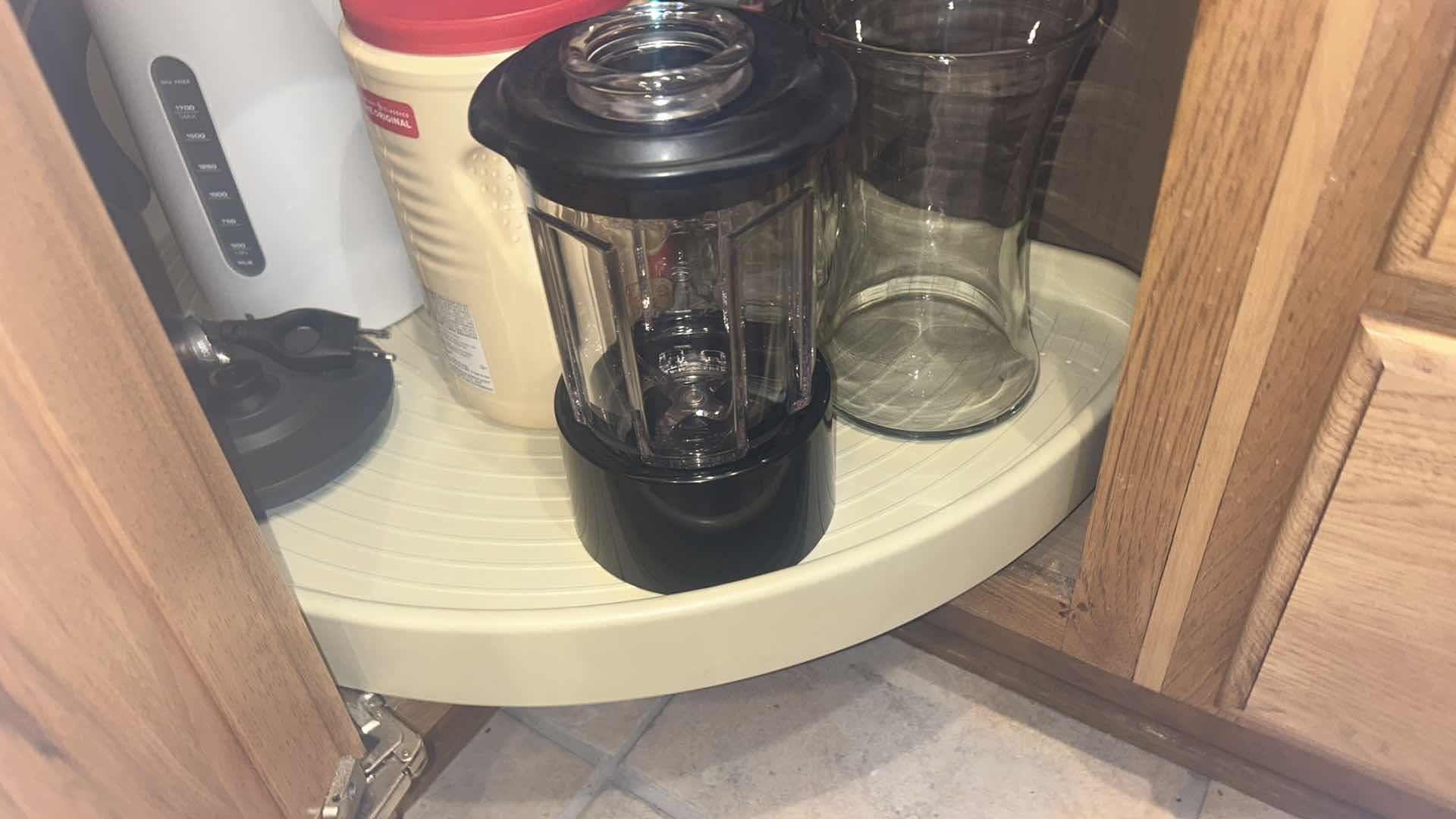 Photo 1 of CONTENTS OF KITCHEN CORNER CABINET