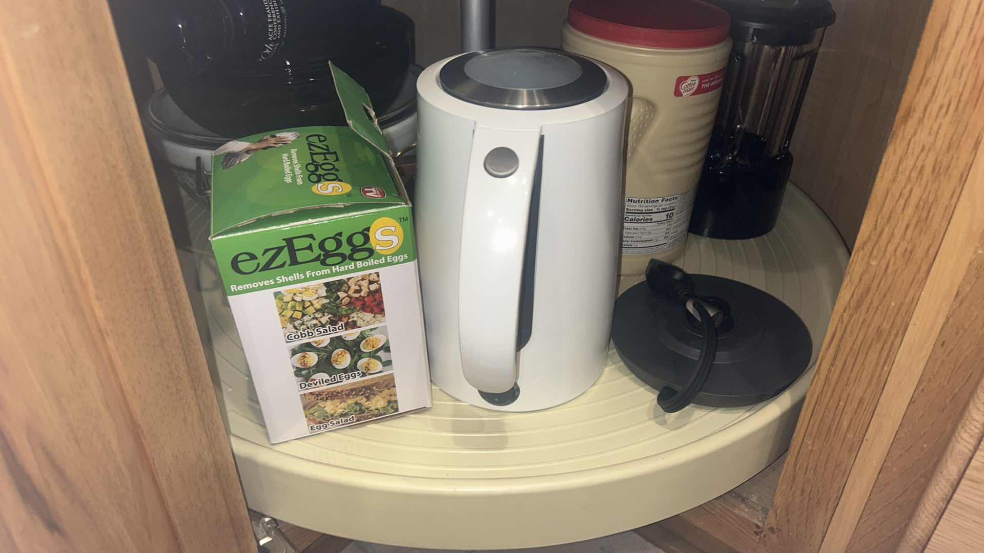 Photo 1 of CONTENTS OF KITCHEN CORNER CABINET