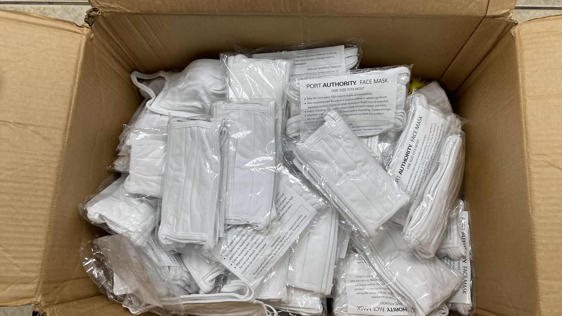 Photo 1 of BOX OF WHITE CLOTH FACE MASKS