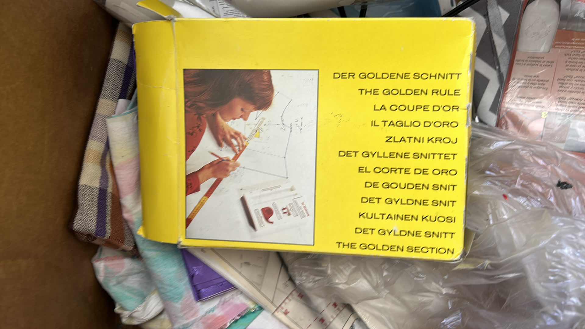 Photo 1 of BOX OF SEWING SUPPLIES AND BOOKS 