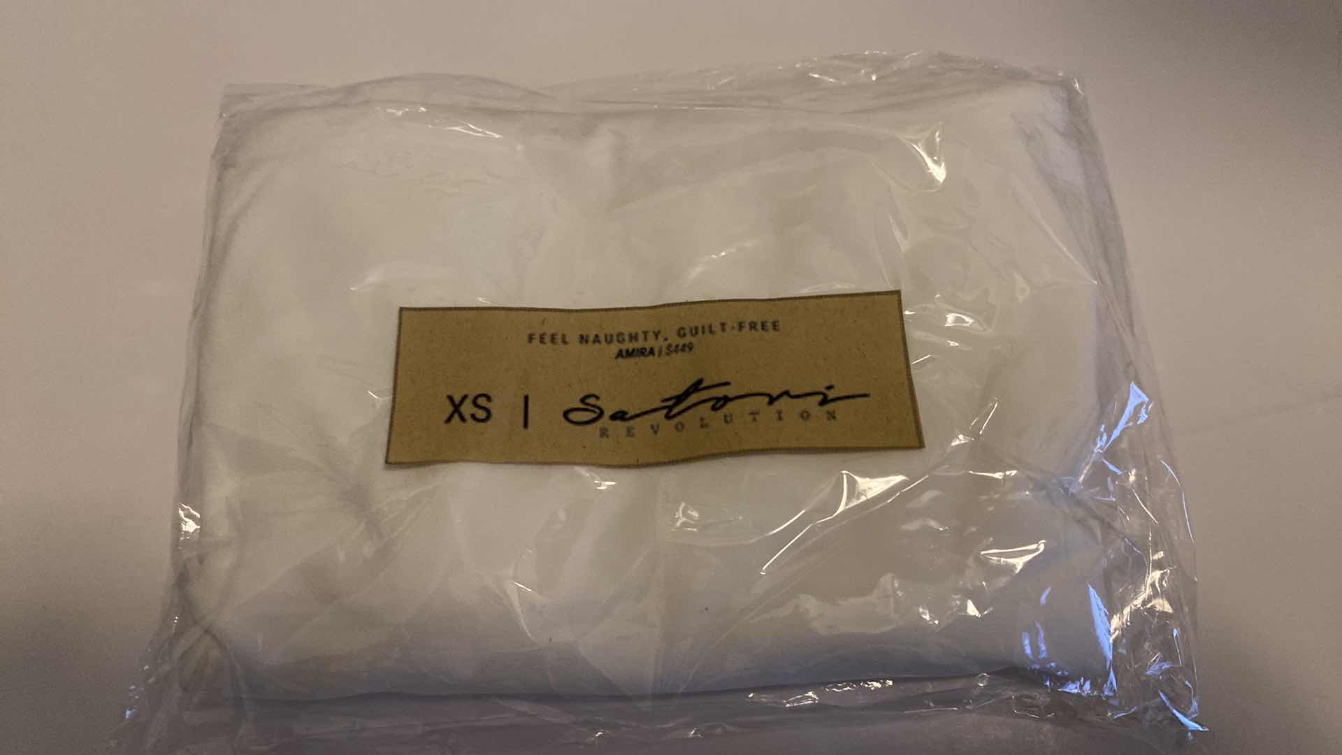 Photo 1 of SIZE X-SMALL AMIRA WHITE BODYSUIT FEATURES ROUND NECKLINE STRAPS AND HI-CUT LEGS. ULTRA SOFT COTTON LINING FOR PEAK COMFORT.