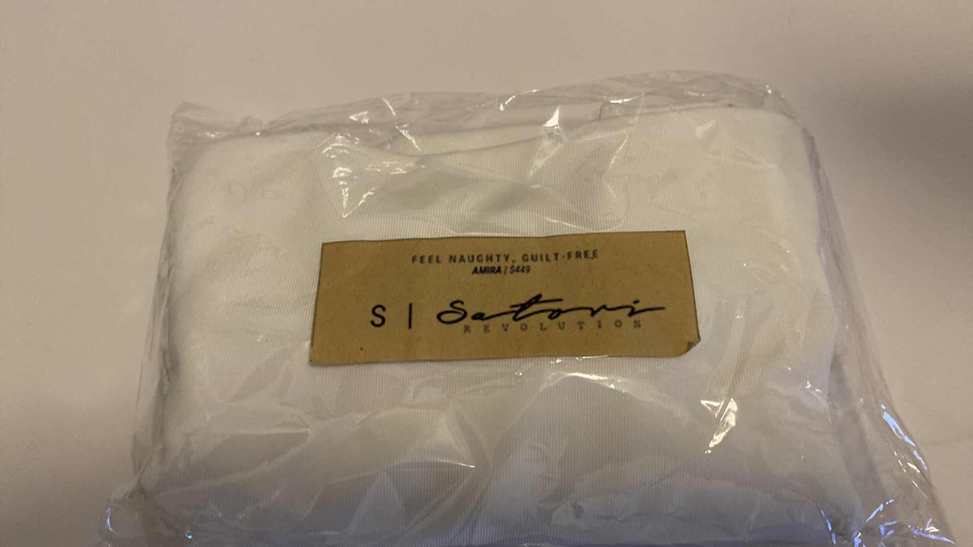 Photo 7 of SIZE SMALL AMIRA WHITE BODYSUIT FEATURES ROUND NECKLINE STRAPS AND HI-CUT LEGS. ULTRA SOFT COTTON LINING FOR PEAK COMFORT.