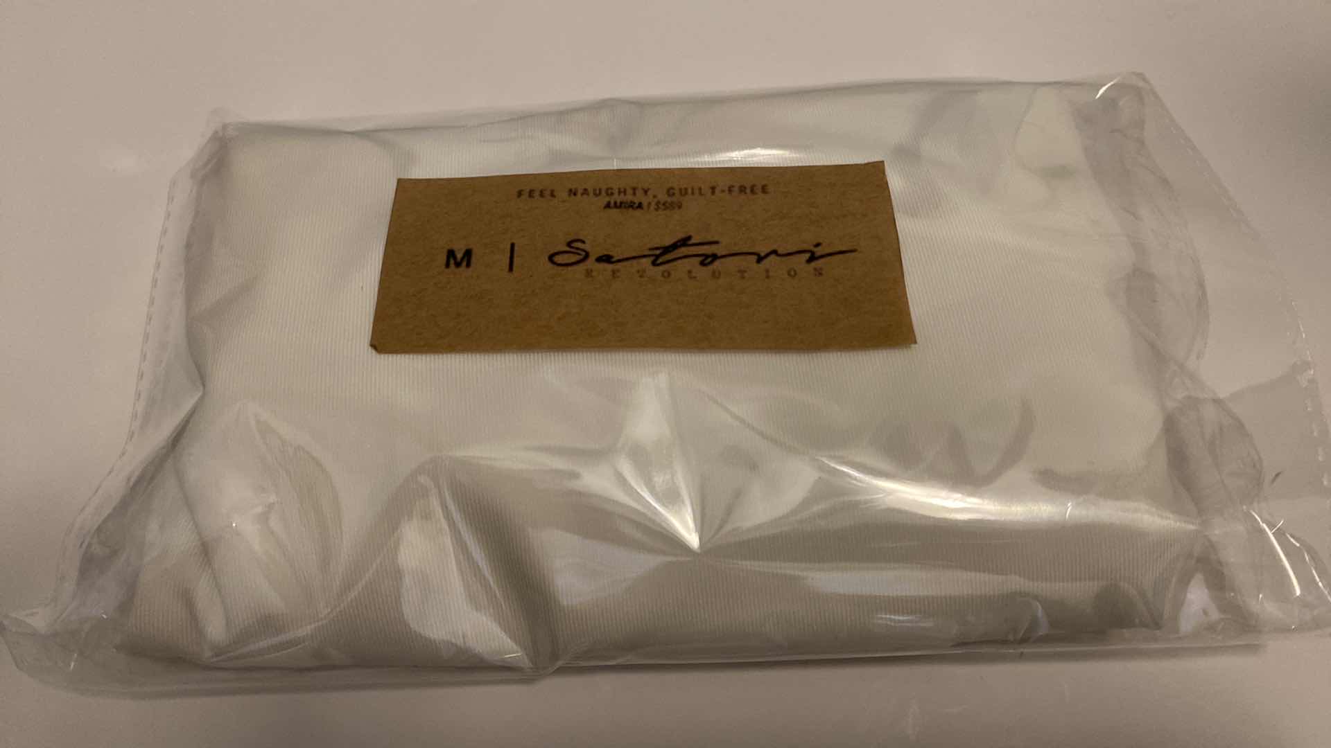 Photo 1 of SIZE MEDIUM AMIRA WHITE BODYSUIT FEATURES ROUND NECKLINE STRAPS AND HI-CUT LEGS. ULTRA SOFT COTTON LINING FOR PEAK COMFORT.