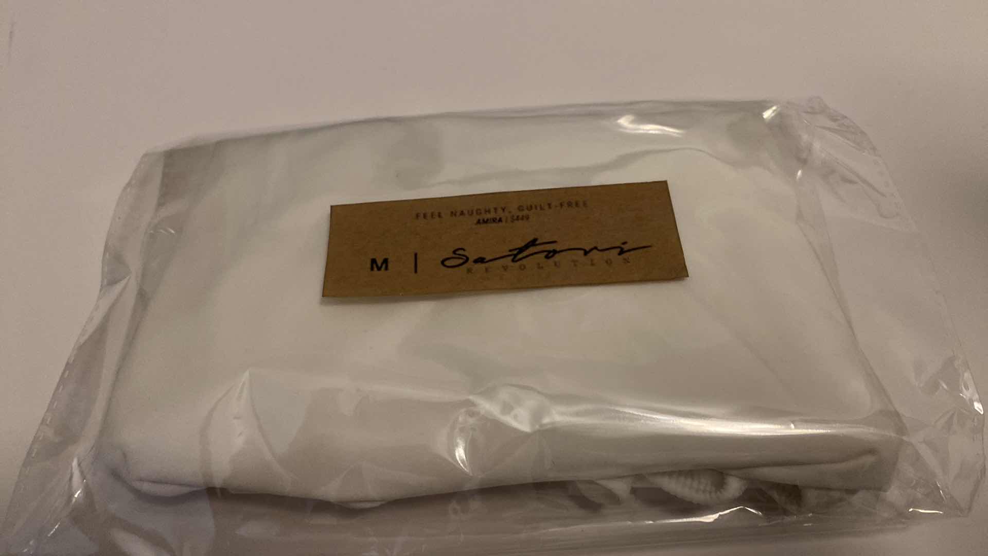 Photo 5 of SIZE MEDIUM AMIRA WHITE BODYSUIT FEATURES ROUND NECKLINE STRAPS AND HI-CUT LEGS. ULTRA SOFT COTTON LINING FOR PEAK COMFORT.