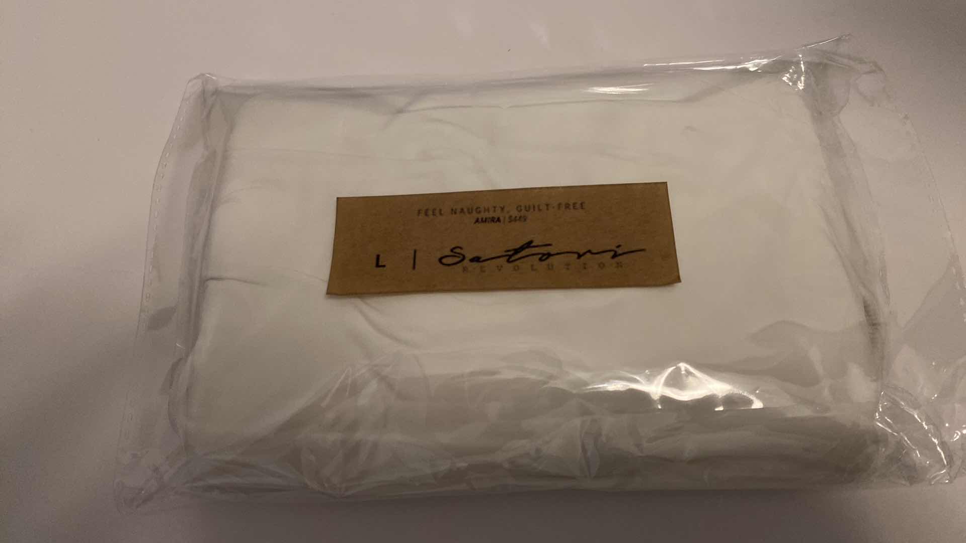 Photo 1 of SIZE LARGE AMIRA WHITE BODYSUIT FEATURES ROUND NECKLINE STRAPS AND HI-CUT LEGS. ULTRA SOFT COTTON LINING FOR PEAK COMFORT.