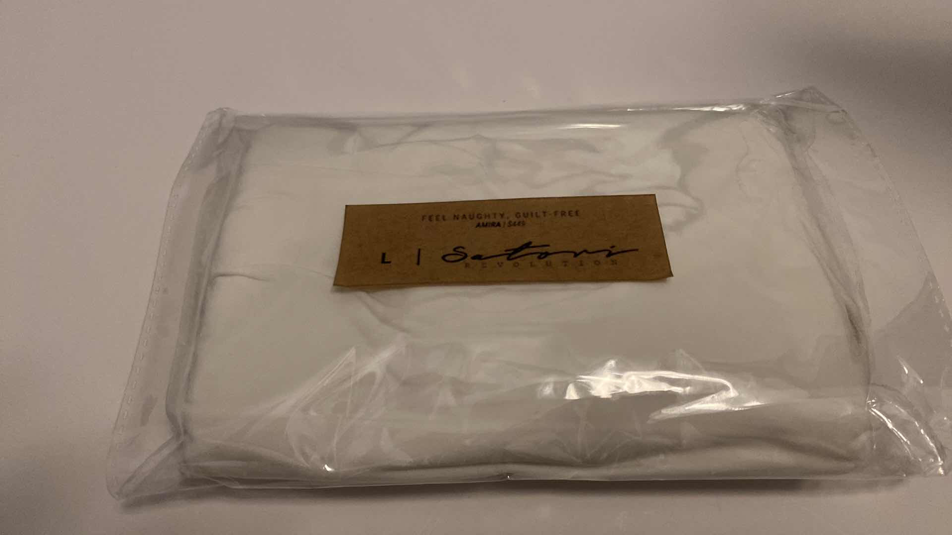 Photo 1 of SIZE LARGE AMIRA WHITE BODYSUIT FEATURES ROUND NECKLINE STRAPS AND HI-CUT LEGS. ULTRA SOFT COTTON LINING FOR PEAK COMFORT.