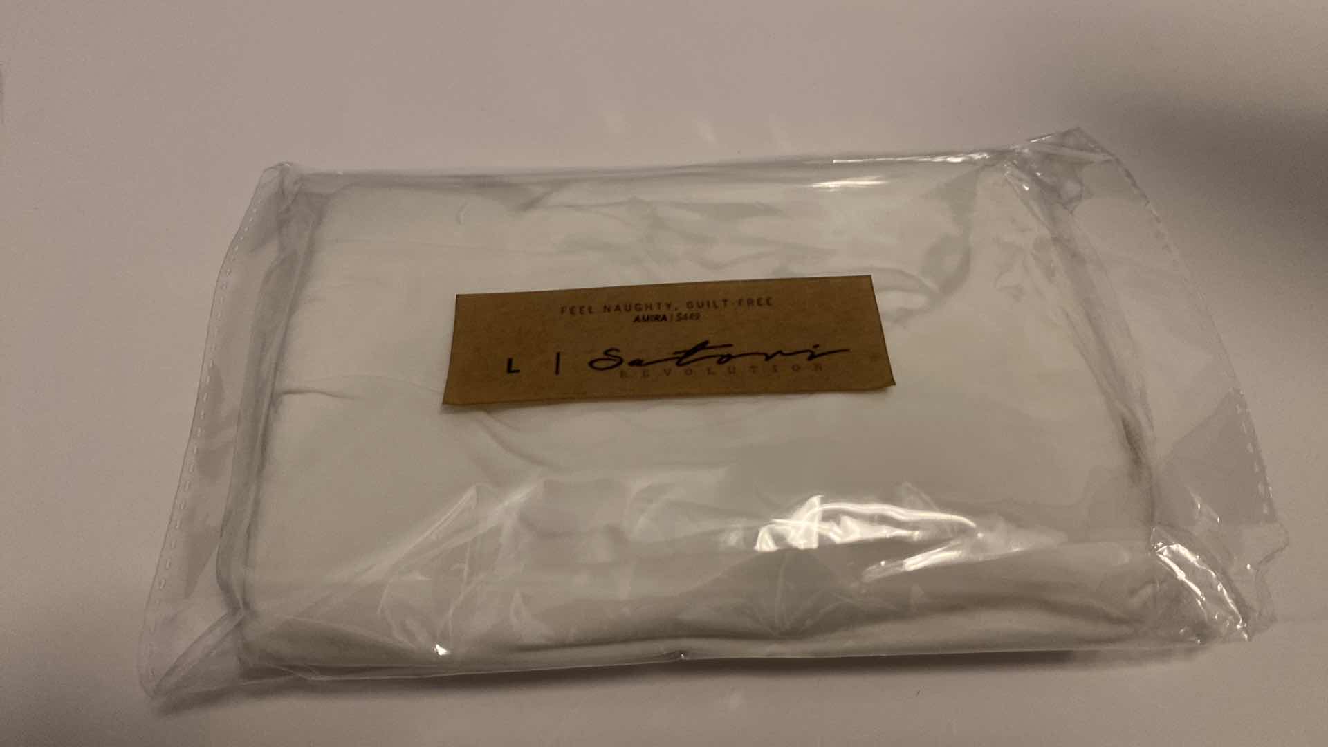 Photo 1 of SIZE LARGE AMIRA WHITE BODYSUIT FEATURES ROUND NECKLINE STRAPS AND HI-CUT LEGS. ULTRA SOFT COTTON LINING FOR PEAK COMFORT.