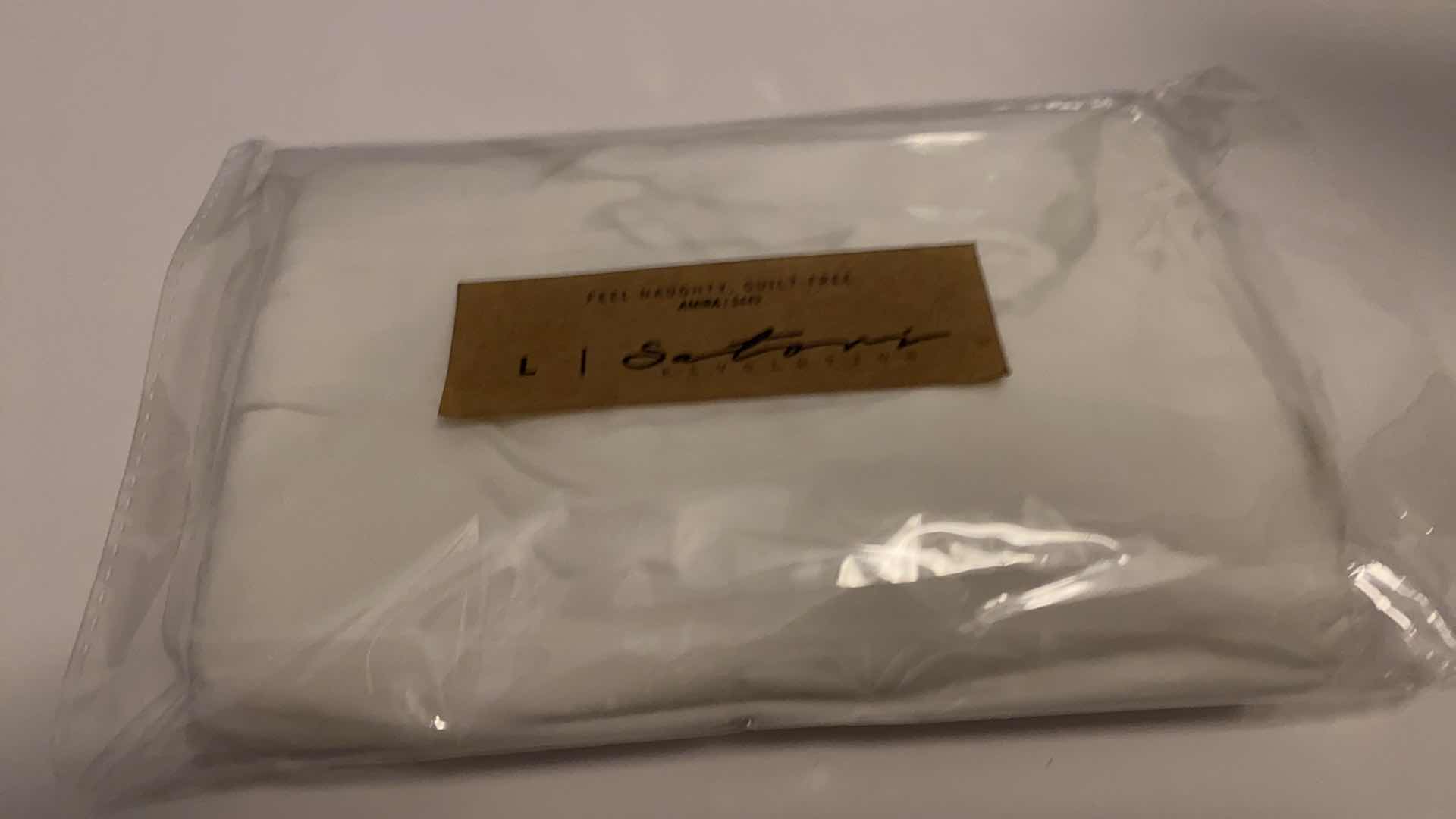 Photo 1 of SIZE LARGE AMIRA WHITE BODYSUIT FEATURES ROUND NECKLINE STRAPS AND HI-CUT LEGS. ULTRA SOFT COTTON LINING FOR PEAK COMFORT.