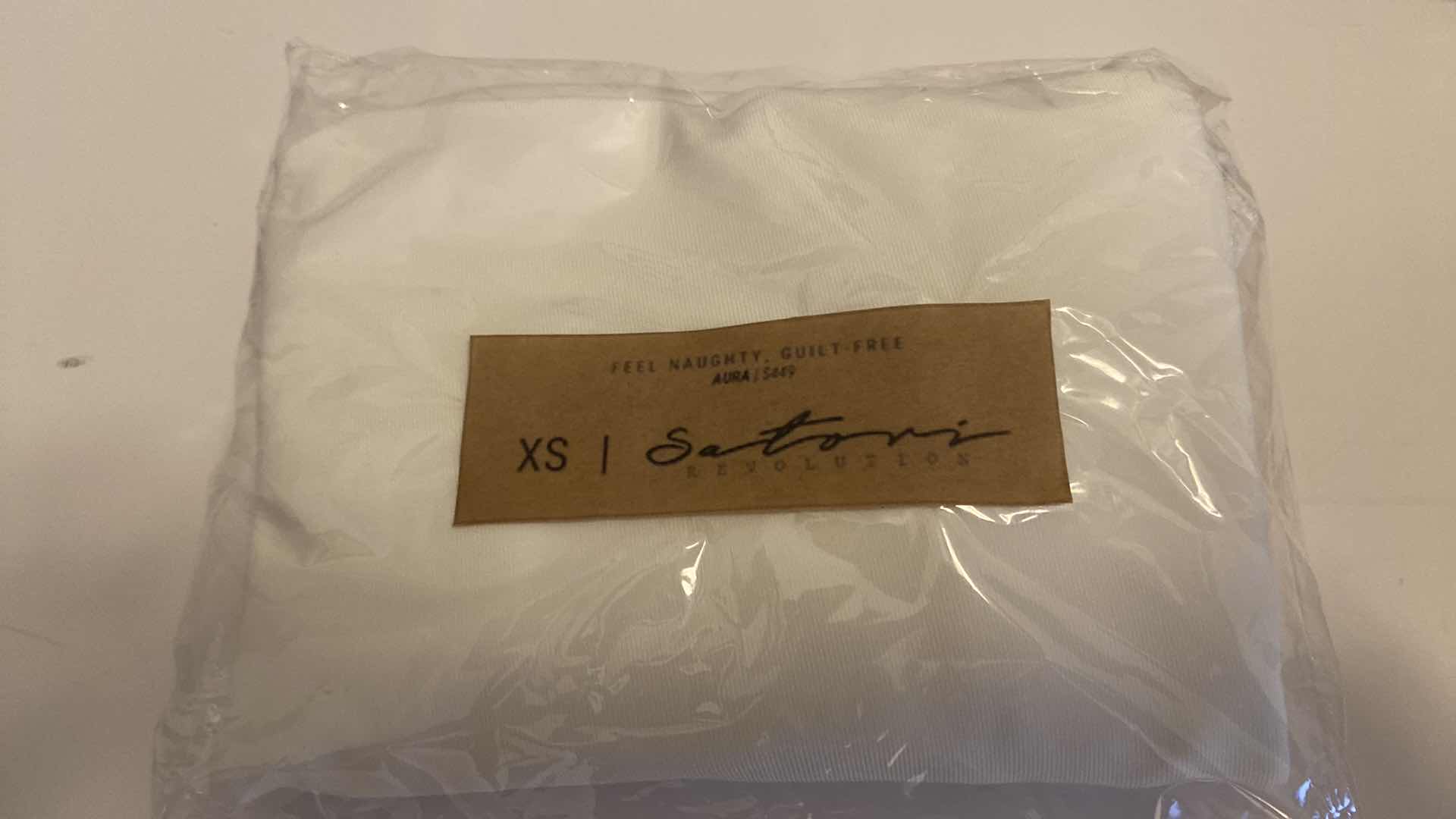 Photo 3 of SIZE X-SMALL WHITE AURA BODYSUIT FEATURES ROUND NECKLINE W EXTENDED STRAPS THAT TIE AND HIGH CUT LEGS, ULTRA SOFT COTTON LINING FOR COMFORT. CAN WEAR AS SWIMWEAR