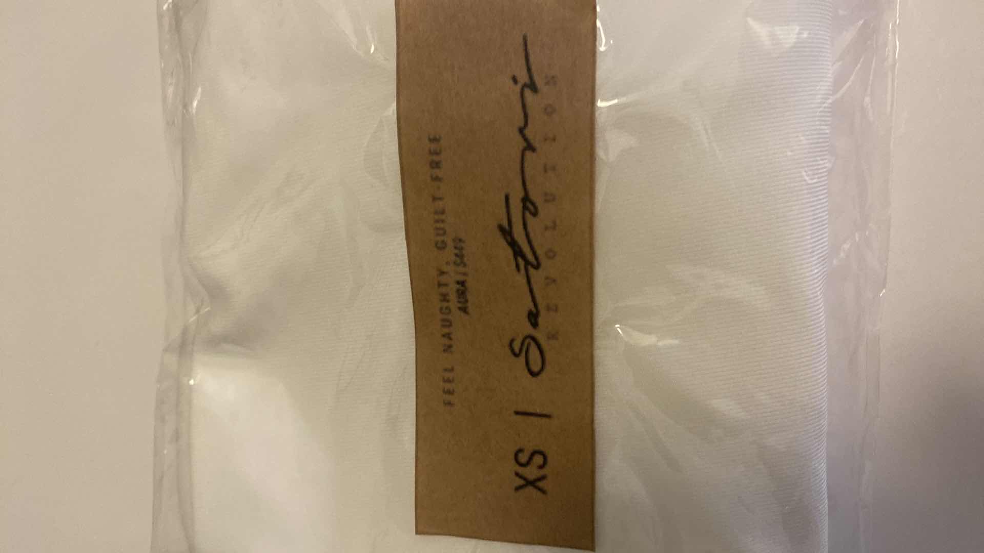 Photo 2 of SIZE X-SMALL WHITE AURA BODYSUIT FEATURES ROUND NECKLINE W EXTENDED STRAPS THAT TIE AND HIGH CUT LEGS, ULTRA SOFT COTTON LINING FOR COMFORT. CAN WEAR AS SWIMWEAR