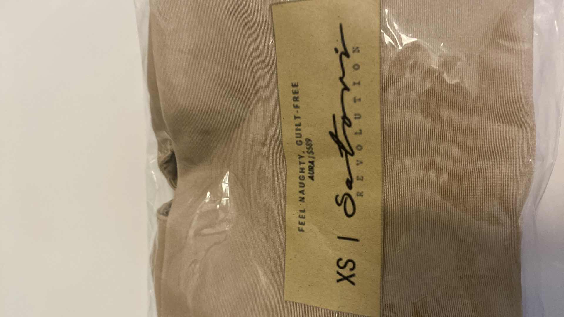 Photo 1 of SIZE X-SMALL NUDE AURA BODYSUIT FEATURES ROUND NECKLINE W EXTENDED STRAPS THAT TIE AND HIGH CUT LEGS, ULTRA SOFT COTTON LINING FOR COMFORT. CAN WEAR AS SWIMWEAR