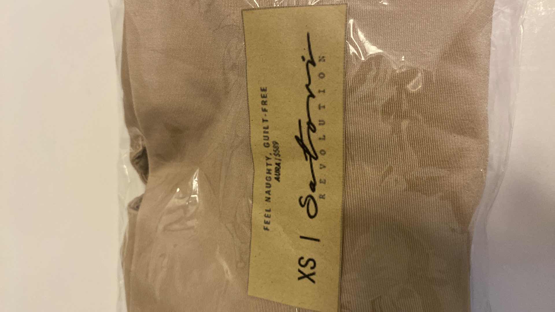 Photo 1 of SIZE X-SMALL NUDE AURA BODYSUIT FEATURES ROUND NECKLINE W EXTENDED STRAPS THAT TIE AND HIGH CUT LEGS, ULTRA SOFT COTTON LINING FOR COMFORT. CAN WEAR AS SWIMWEAR