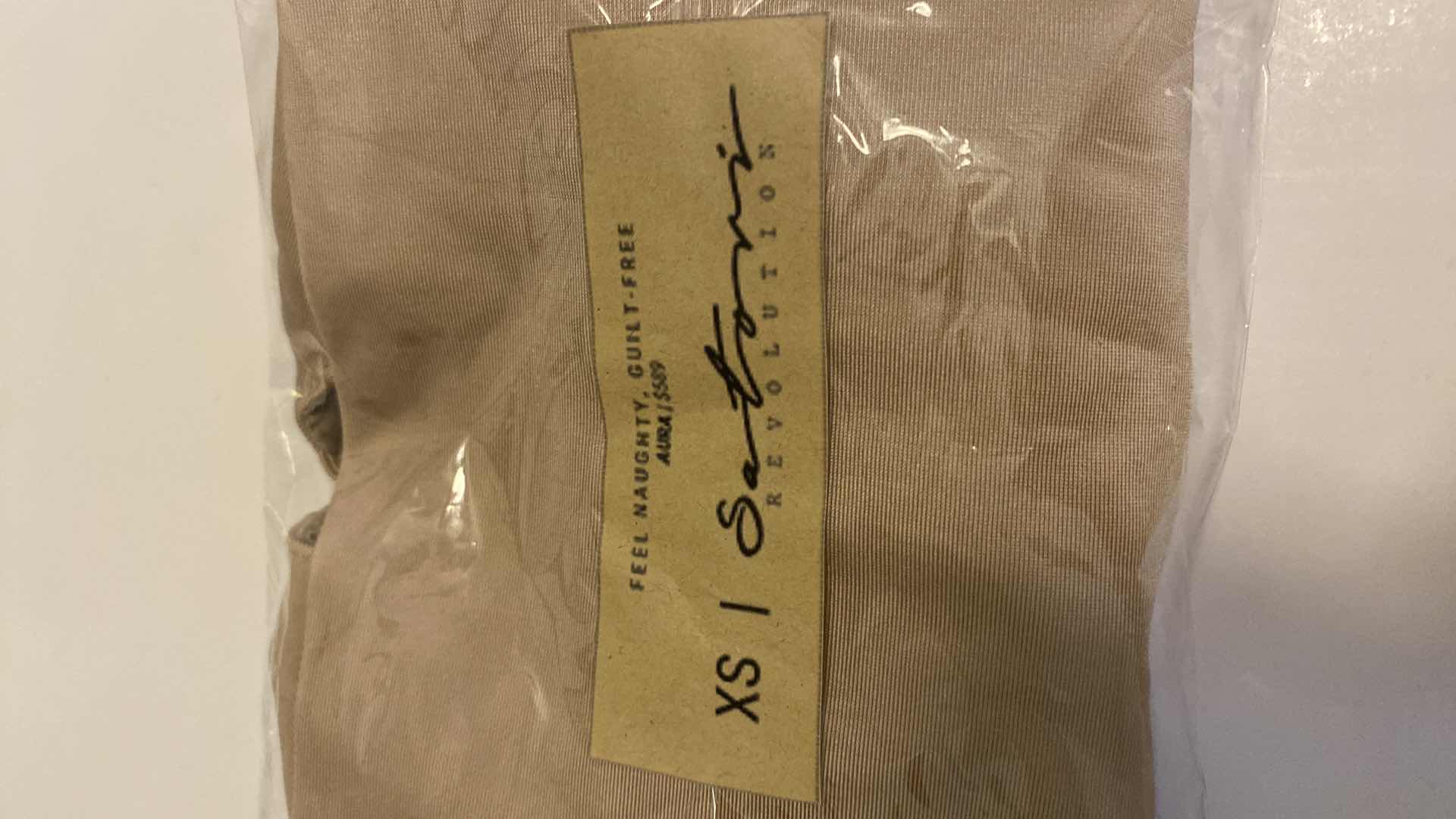 Photo 1 of SIZE X-SMALL NUDE AURA BODYSUIT FEATURES ROUND NECKLINE W EXTENDED STRAPS THAT TIE AND HIGH CUT LEGS, ULTRA SOFT COTTON LINING FOR COMFORT. CAN WEAR AS SWIMWEAR