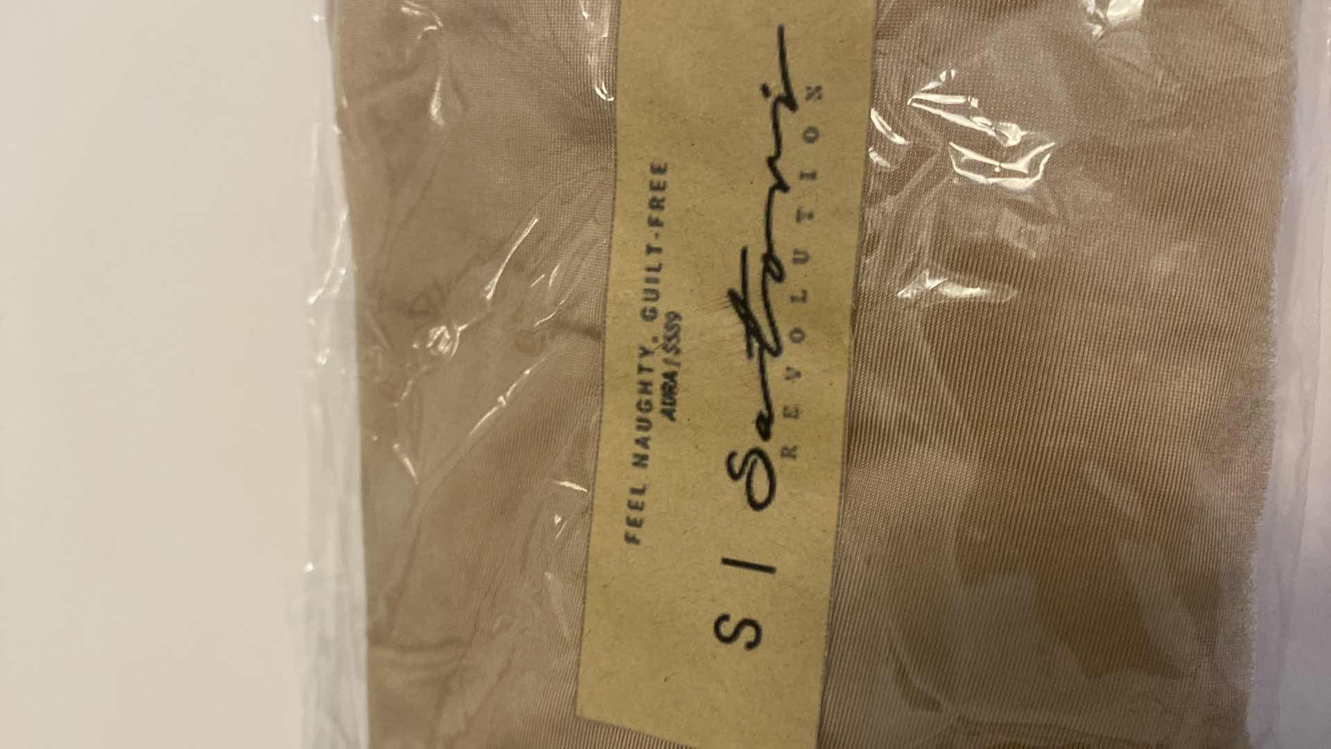 Photo 2 of SIZE SMALL NUDE AURA BODYSUIT FEATURES ROUND NECKLINE W EXTENDED STRAPS THAT TIE AND HIGH CUT LEGS, ULTRA SOFT COTTON LINING FOR COMFORT. CAN WEAR AS SWIMWEAR