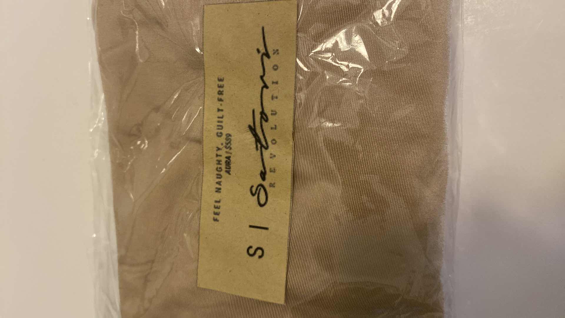 Photo 5 of SIZE SMALL NUDE AURA BODYSUIT FEATURES ROUND NECKLINE W EXTENDED STRAPS THAT TIE AND HIGH CUT LEGS, ULTRA SOFT COTTON LINING FOR COMFORT. CAN WEAR AS SWIMWEAR