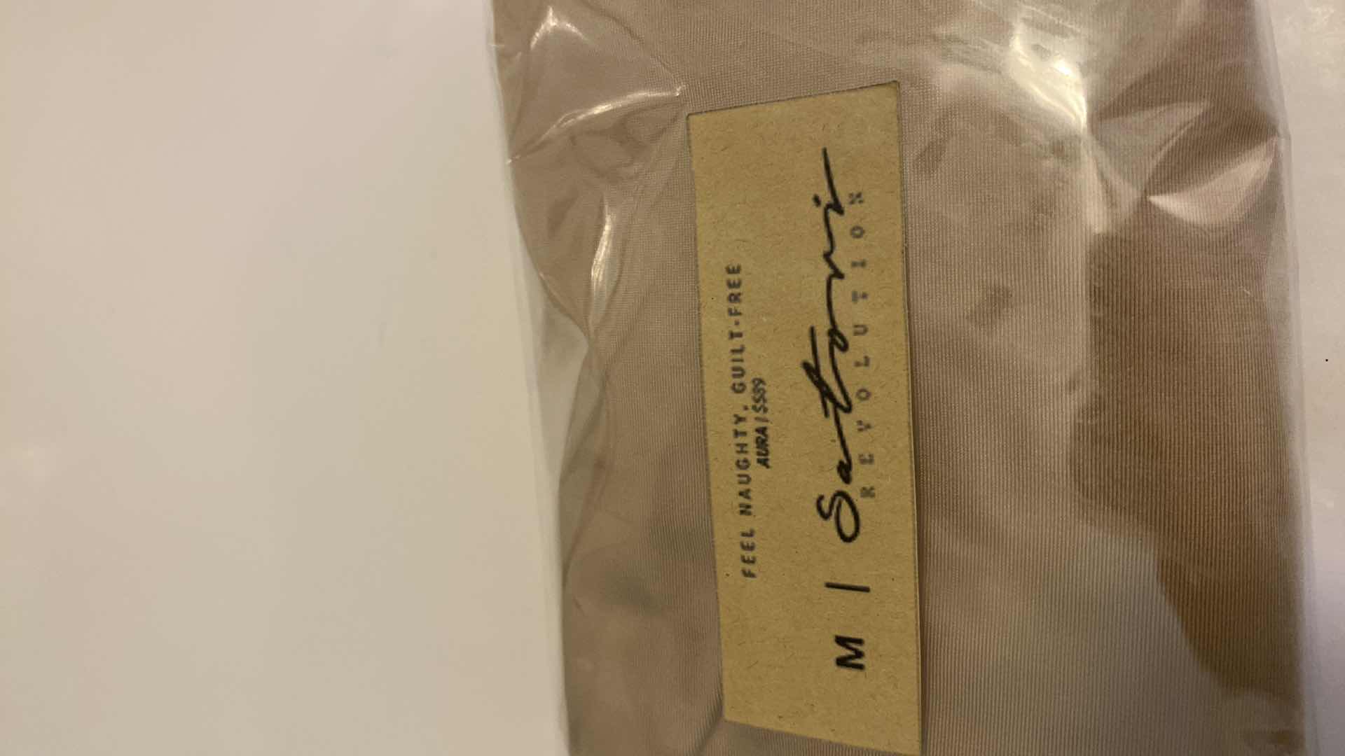 Photo 1 of SIZE MEDIUM NUDE AURA BODYSUIT FEATURES ROUND NECKLINE W EXTENDED STRAPS THAT TIE AND HIGH CUT LEGS, ULTRA SOFT COTTON LINING FOR COMFORT. CAN WEAR AS SWIMWEAR