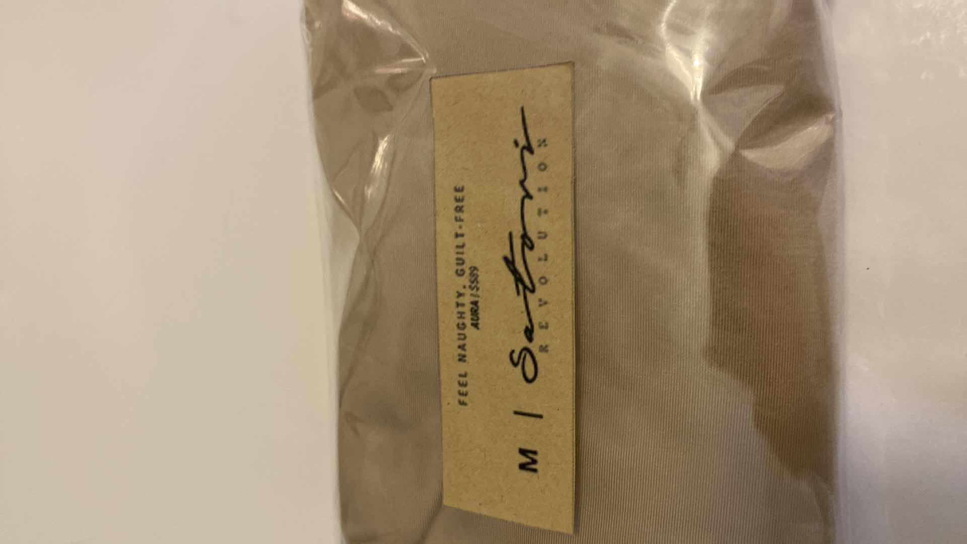 Photo 1 of SIZE MEDIUM NUDE AURA BODYSUIT FEATURES ROUND NECKLINE W EXTENDED STRAPS THAT TIE AND HIGH CUT LEGS, ULTRA SOFT COTTON LINING FOR COMFORT. CAN WEAR AS SWIMWEAR