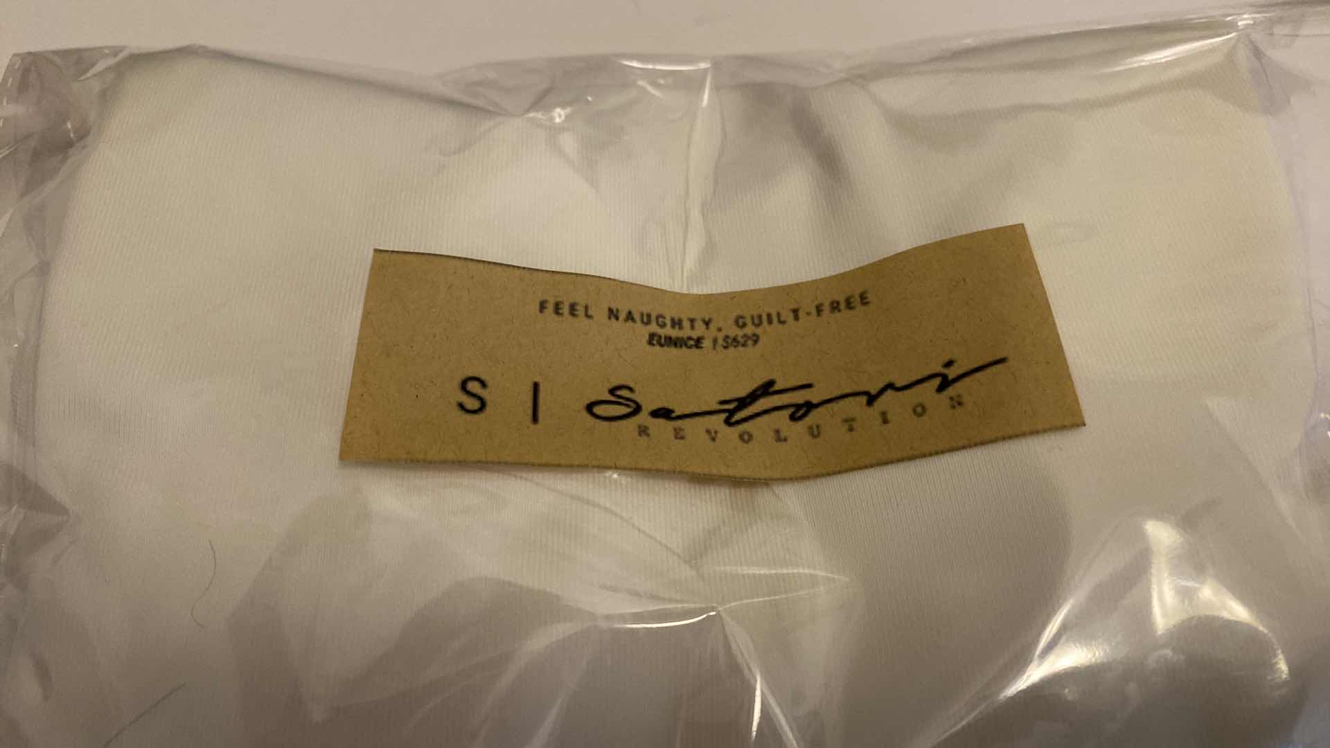 Photo 4 of SIZE SMALL WHITE EUNICE BODYSUIT FEATURES A BOAT NECK LINE WITH HIGH COURT LEGS AND A LOW CUT ON SIDES THAT GIVE YOU AM EDGY LOOK.