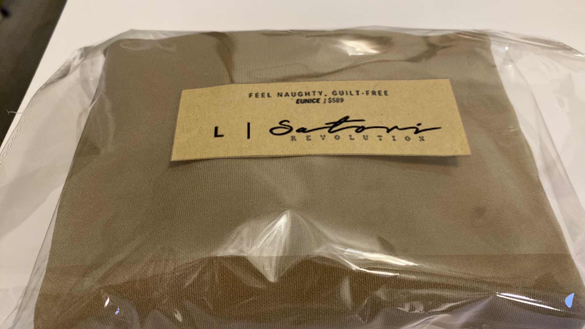 Photo 1 of SIZE LARGE  EUNICE BODYSUIT FEATURES A BOAT NECK LINE WITH HIGH COURT LEGS AND A LOW CUT ON SIDES THAT GIVE YOU AM EDGY LOOK.