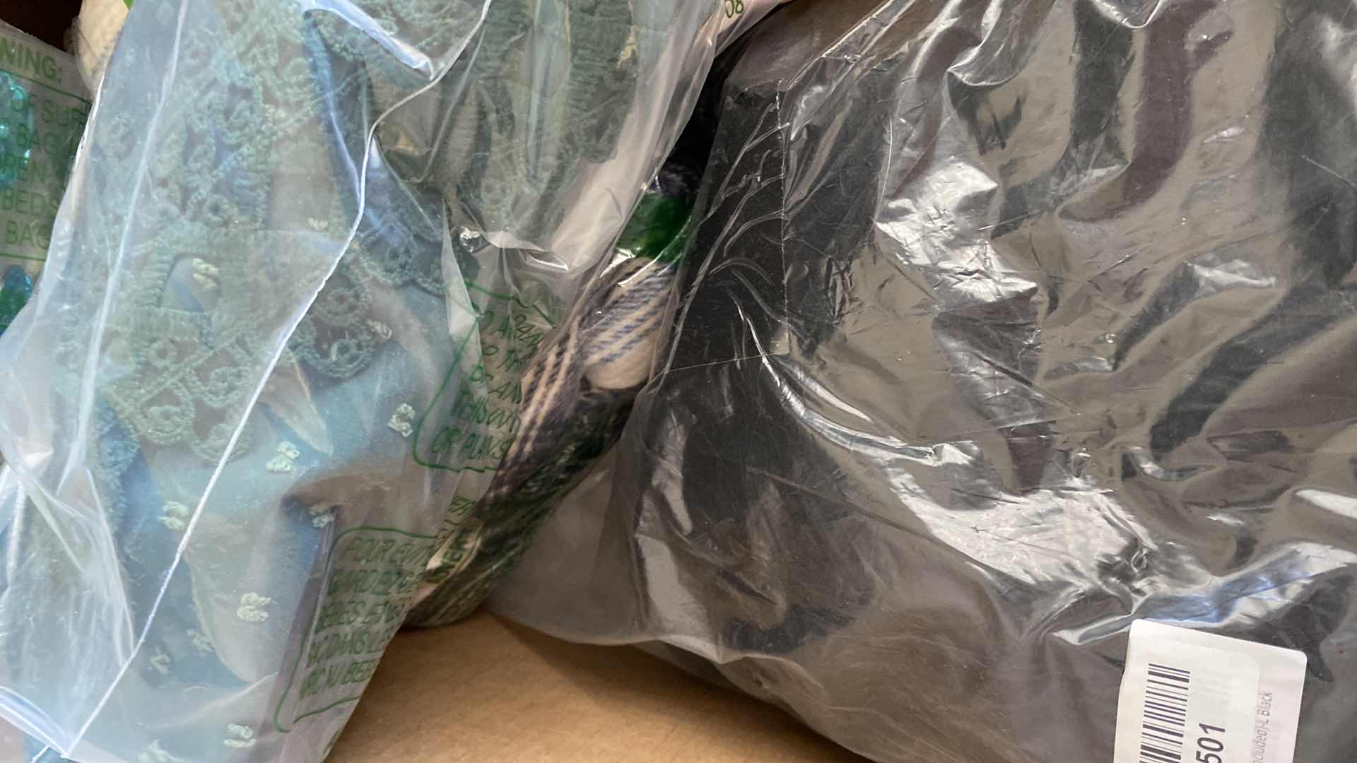 Photo 1 of BOX OF ASSORTED CLOTHES RUG SHOWER CURTAIN HANGER