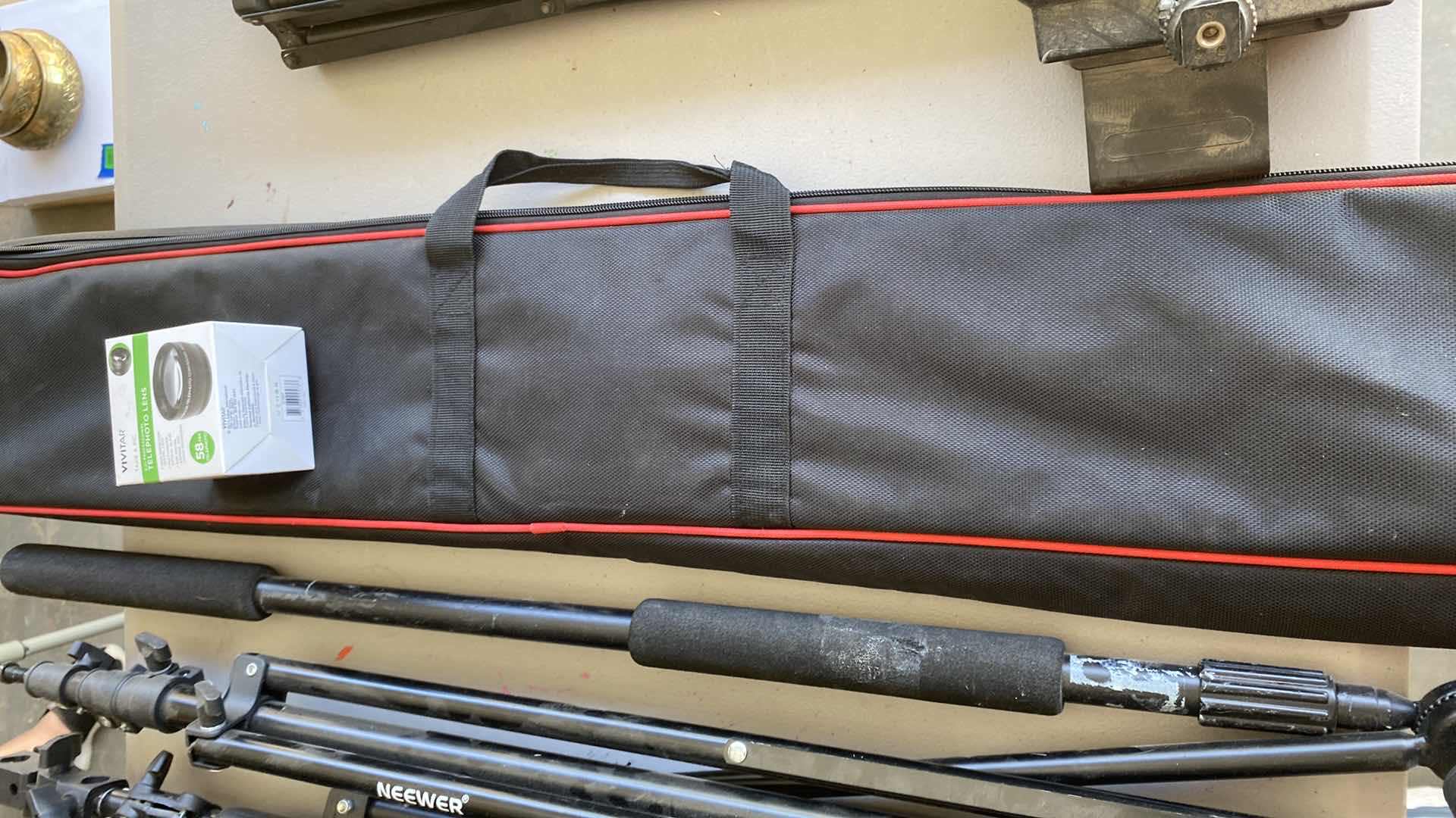 Photo 1 of CAMERA EQUIPMENT ASSORTMENT TRI PODS, MONO PODS AND MORE