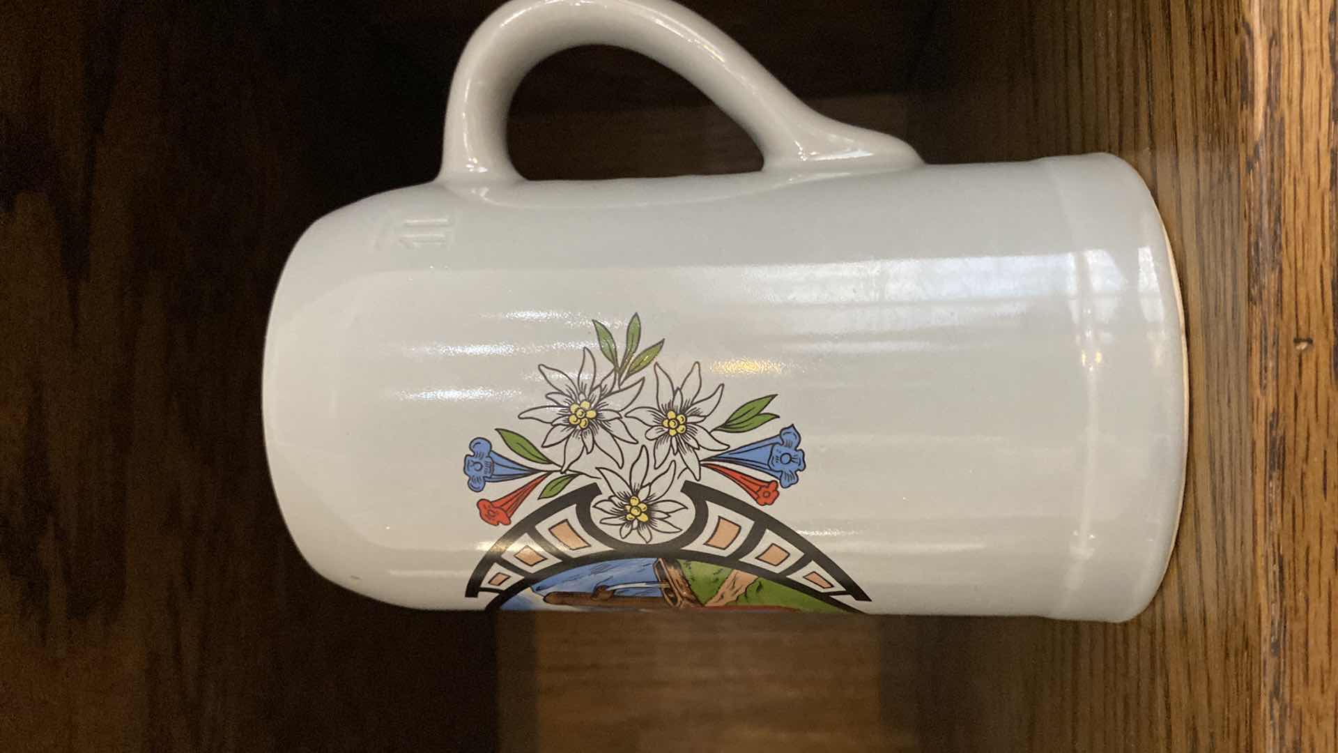Photo 1 of PAIR OF MYNCHEN BOTTLES H10.5” FROM MUNICH AND MUG FROM EL PASO TX