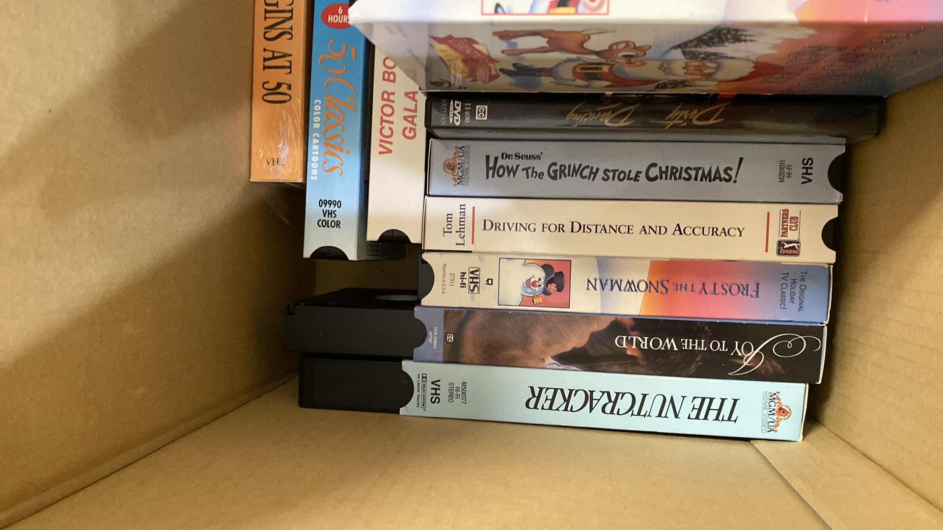 Photo 1 of LARGE BOX OF DVD AND VHS MOVIES