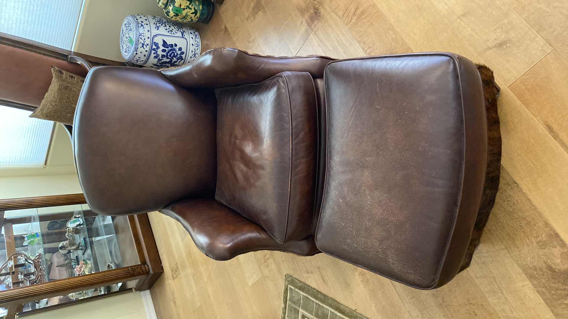 Photo 1 of WRANGLER HOME LEATHER AND HIDE OCCASIONAL CHAIR WITH OTTOMAN