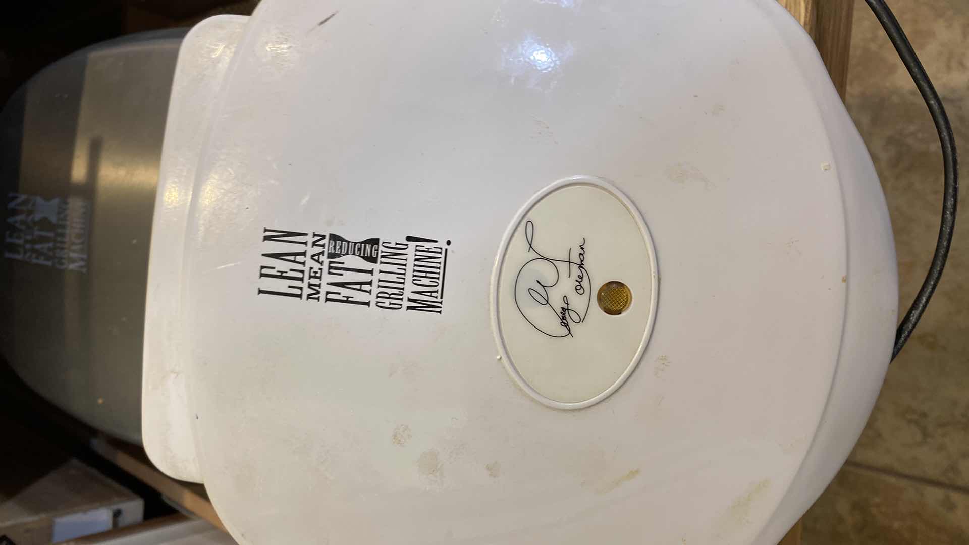 Photo 1 of CONTENTS OF KITCHEN CABINET 2 LEAN MEAN GRILLING MACHINES AND FOOD SCALE