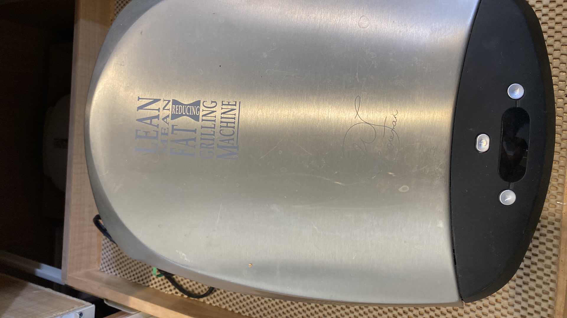 Photo 1 of CONTENTS OF KITCHEN CABINET 2 LEAN MEAN GRILLING MACHINES AND FOOD SCALE