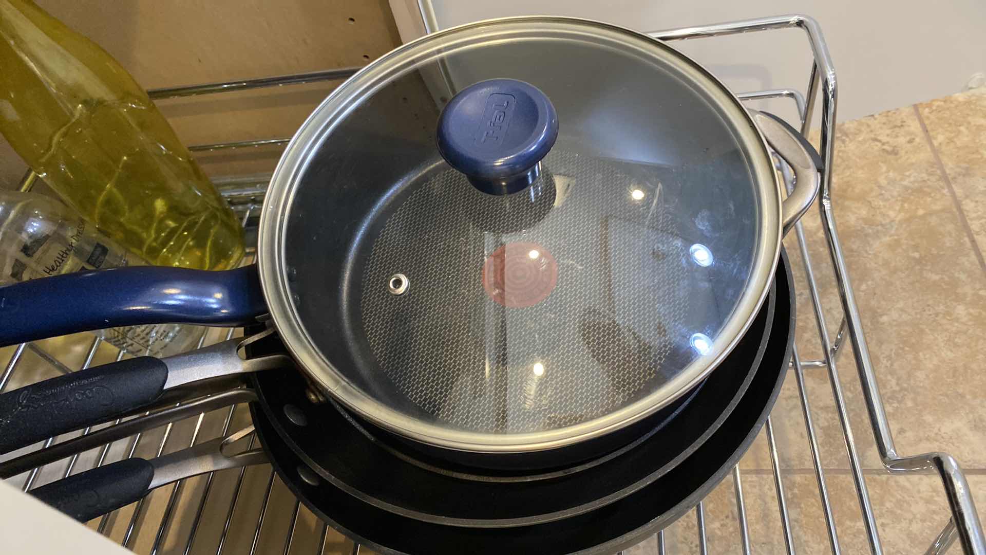 Photo 1 of CONTENTS OF KITCHEN CABINET PANS TOASTER CONDIMENTS