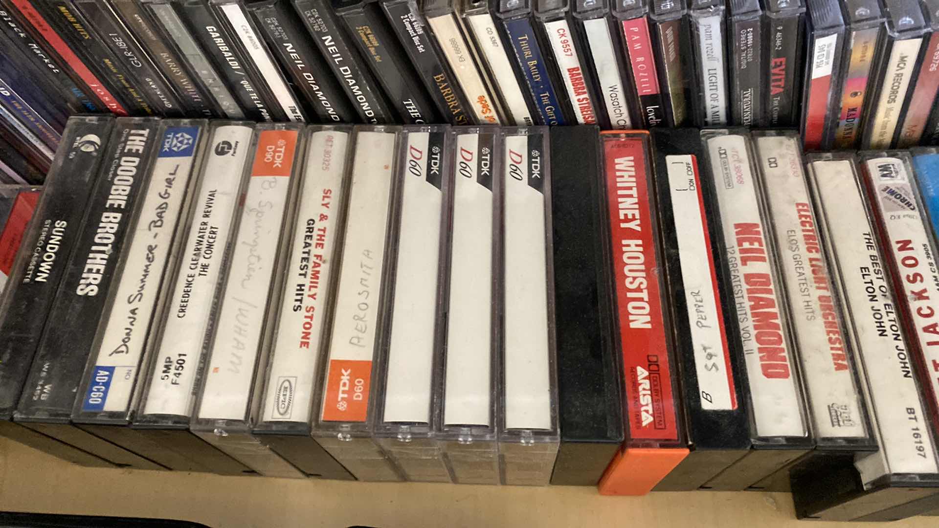 Photo 2 of CONTENTS OF CABINET FAMILY ROOM CDS SPEAKERS CASSETTES