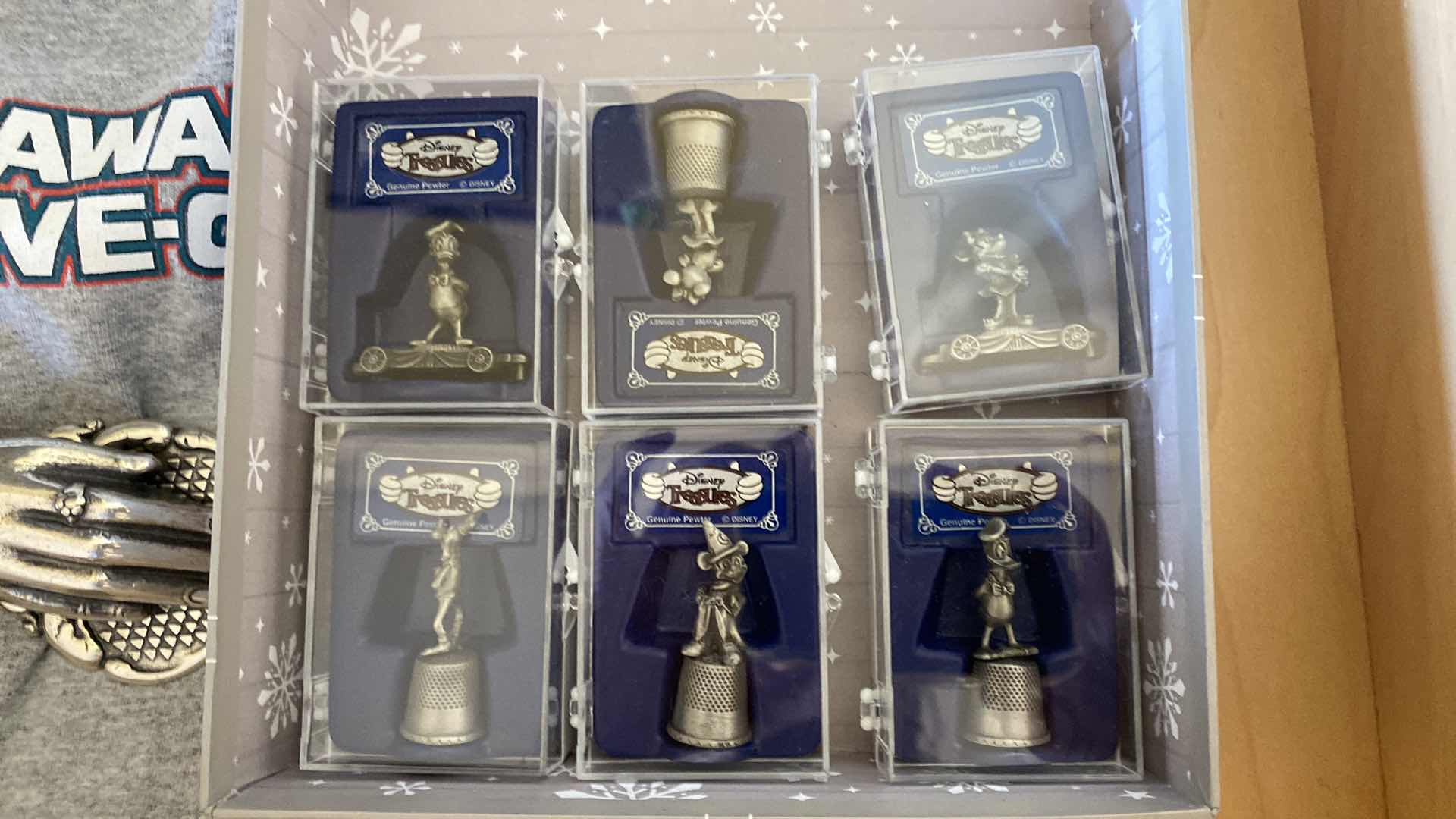 Photo 3 of CONTENTS OF DRAWER FAMILY ROOM DISNEY T SHIRT AND THIMBALS AND MORE