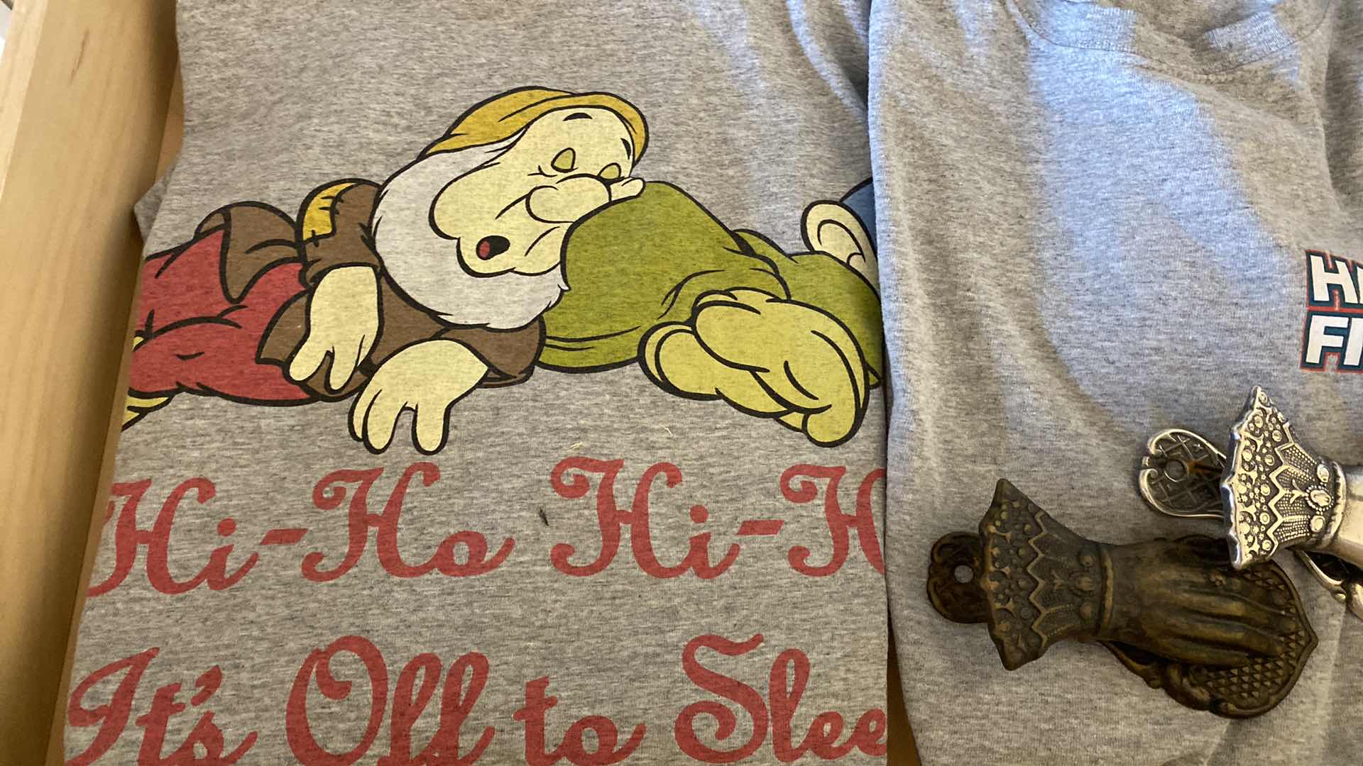 Photo 2 of CONTENTS OF DRAWER FAMILY ROOM DISNEY T SHIRT AND THIMBALS AND MORE