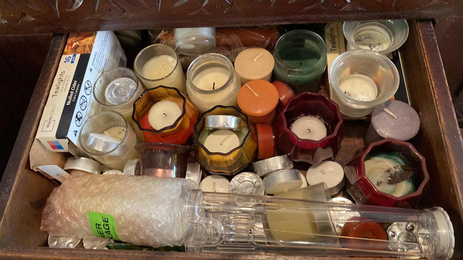 Photo 1 of 2 DRAWERS OF VOTIVE CANDLES AND HOLDERS IN SIDEBOARD