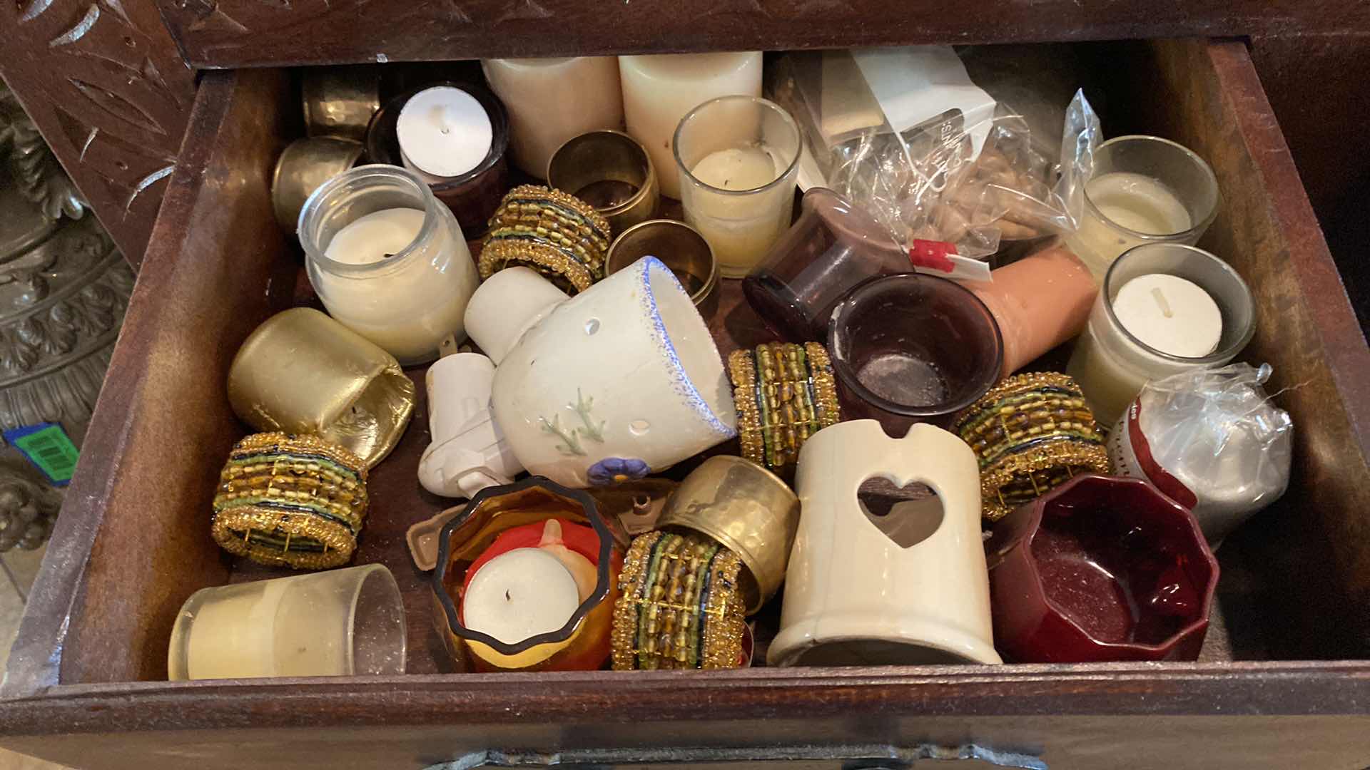 Photo 1 of 2 DRAWERS OF VOTIVE CANDLES AND HOLDERS IN SIDEBOARD