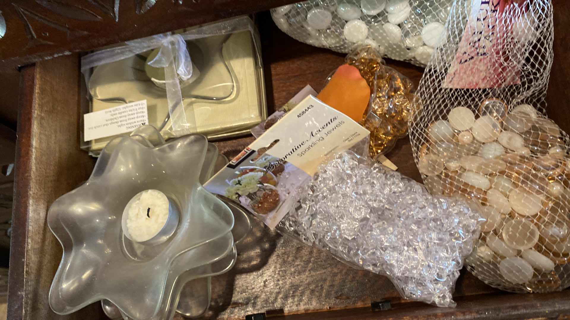 Photo 1 of 2 DRAWERS GLASS MARBLES AND VOTIVE HOLDERS IN SIDEBOARD