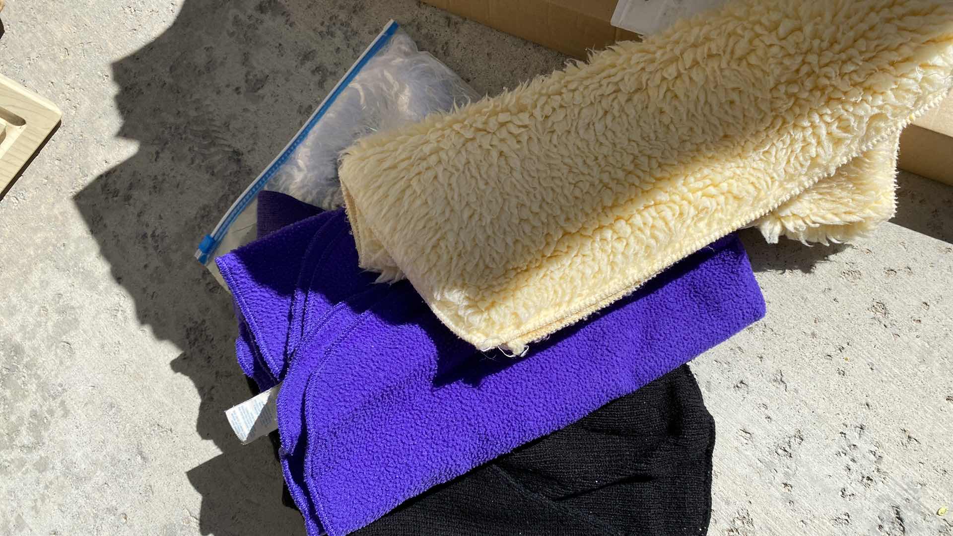 Photo 1 of BOX OF ASSORTED BLANKETS AND DOG CLOTHES