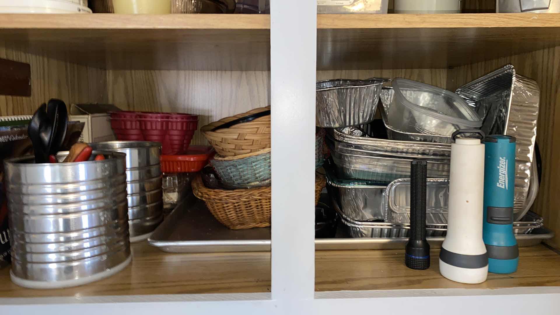 Photo 1 of CONTENTS OF KITCHEN CABINET ALUMINUM PANS BASKETS CRAFT PAINTS AND MORE