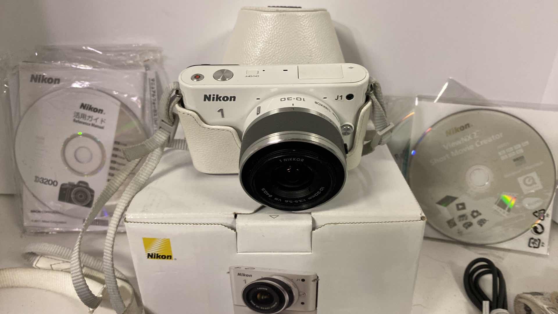 Photo 1 of NIKON 1 CAMERA WITH CASE, MACRO  LENS, 2 CHARGERS BOOKLETS