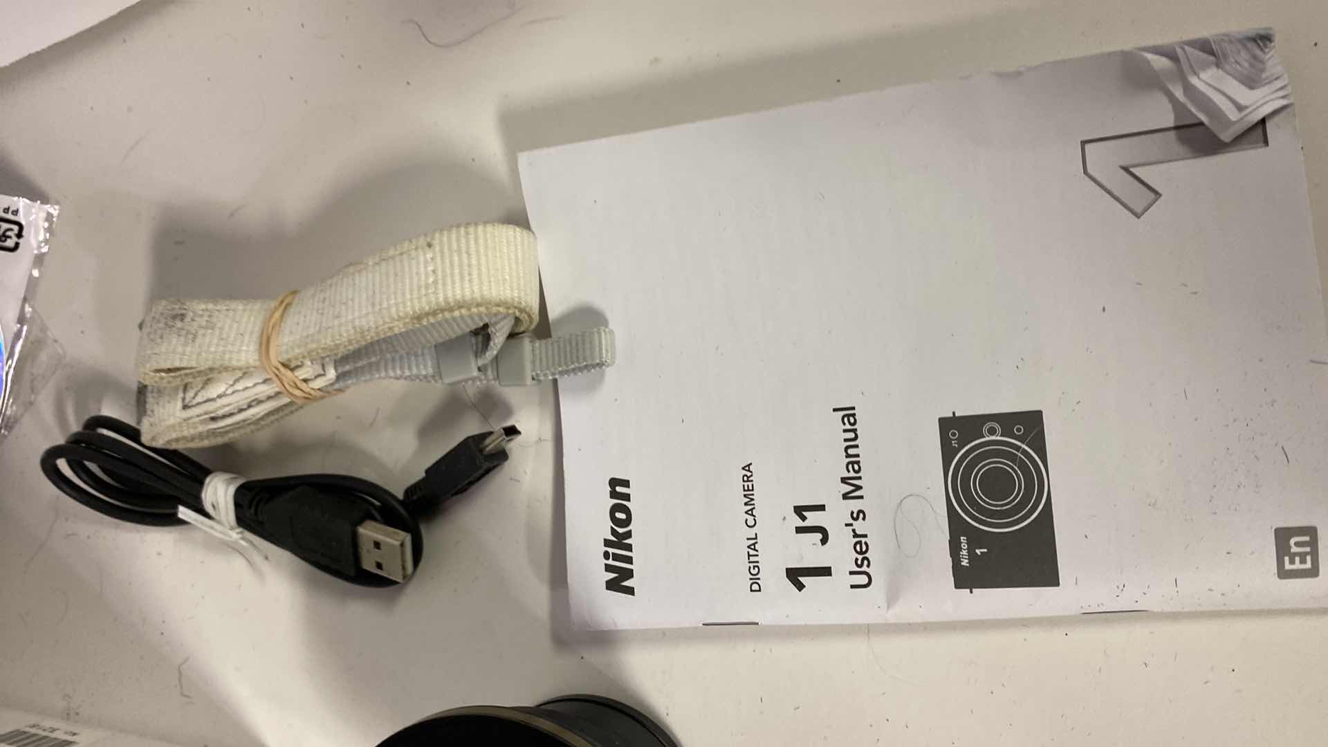 Photo 1 of NIKON 1 CAMERA WITH CASE, MACRO  LENS, 2 CHARGERS BOOKLETS