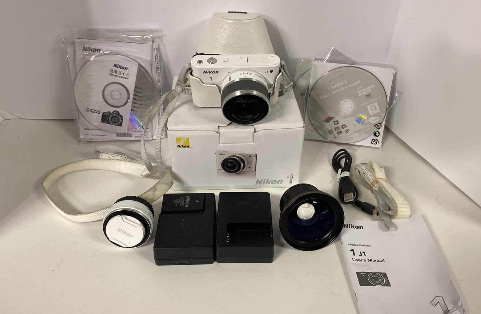 Photo 1 of NIKON 1 CAMERA WITH CASE, MACRO  LENS, 2 CHARGERS BOOKLETS